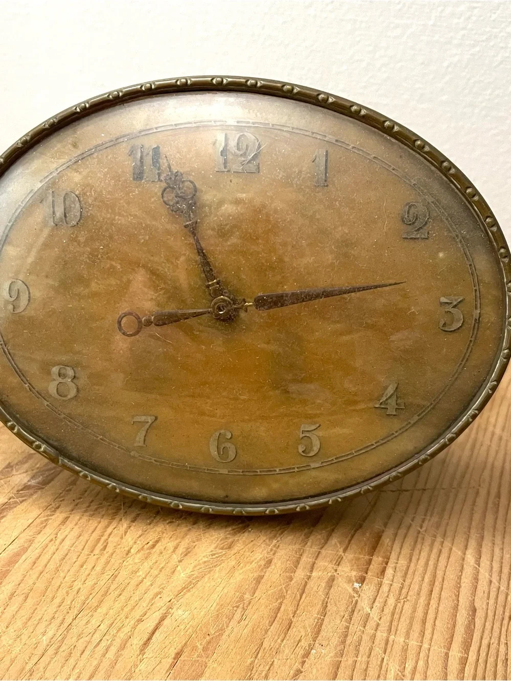 Vintage Oval brass Clock. 5” wide on brass stand